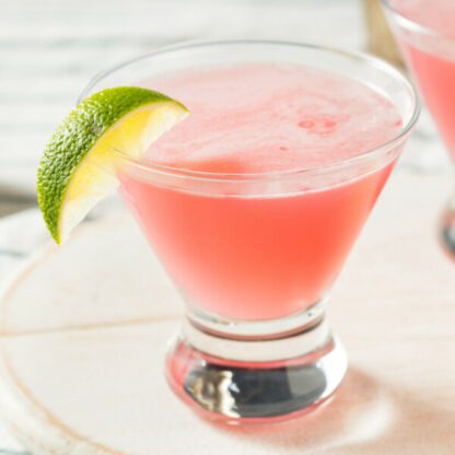 Boozy Refreshing Cranberry Cosmopolitan Cocktail With Vodka Triple Sec And Lime Juice With A Lime Garnish