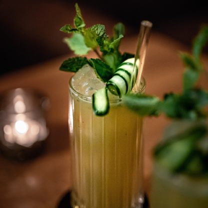 Go-To Cocktail With Gin Elderflower Liqueur Lime Juice Cucumber Slices Mint Leaves And Ginger Beer