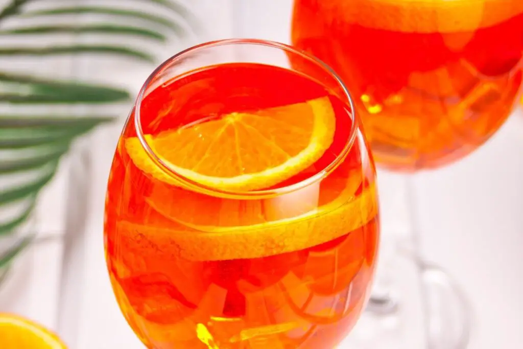 12 Crowd Pleasing Punch Recipes For Your Summer Cookout &Mdash; The Shaken Cocktail Port Royal Punch With Rum Pineapple Juice Mango Juice Genadine And Lemon Lime Soda